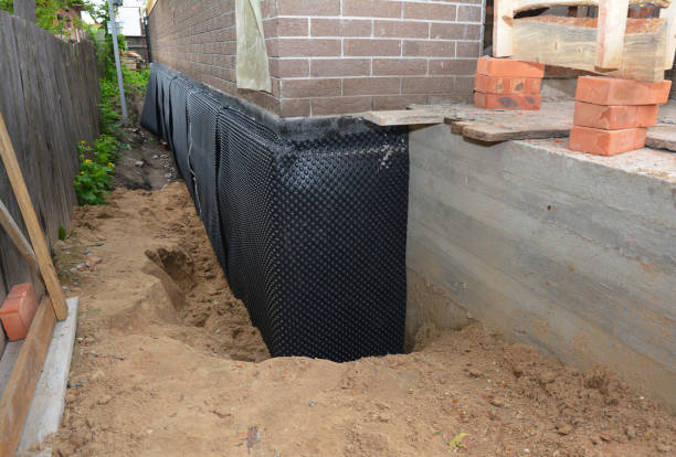 Happy homeowners after waterproofing job in New Concord
